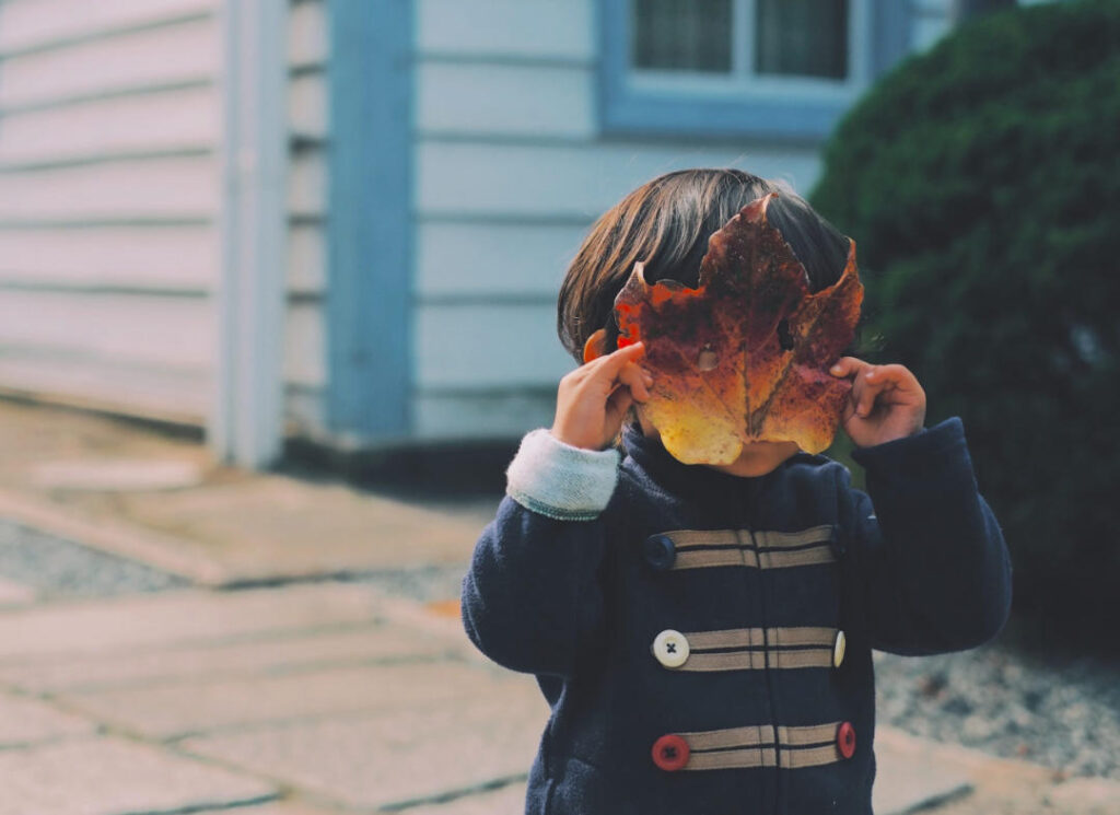 kid with leaf mask parenting during coronavirus covid mary democker