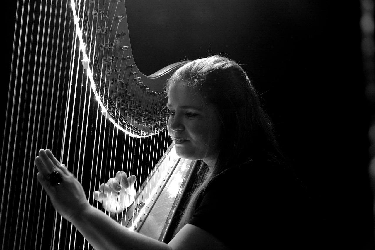 young woman playing harp
